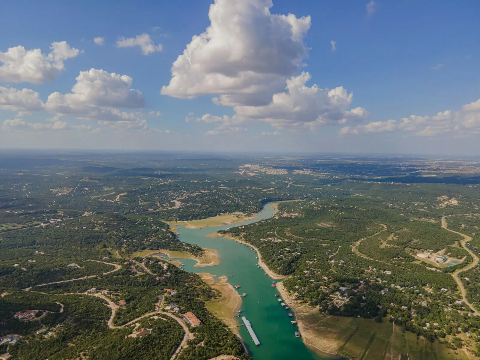 Aerial view of a lake winding through the Texas Hill Country
