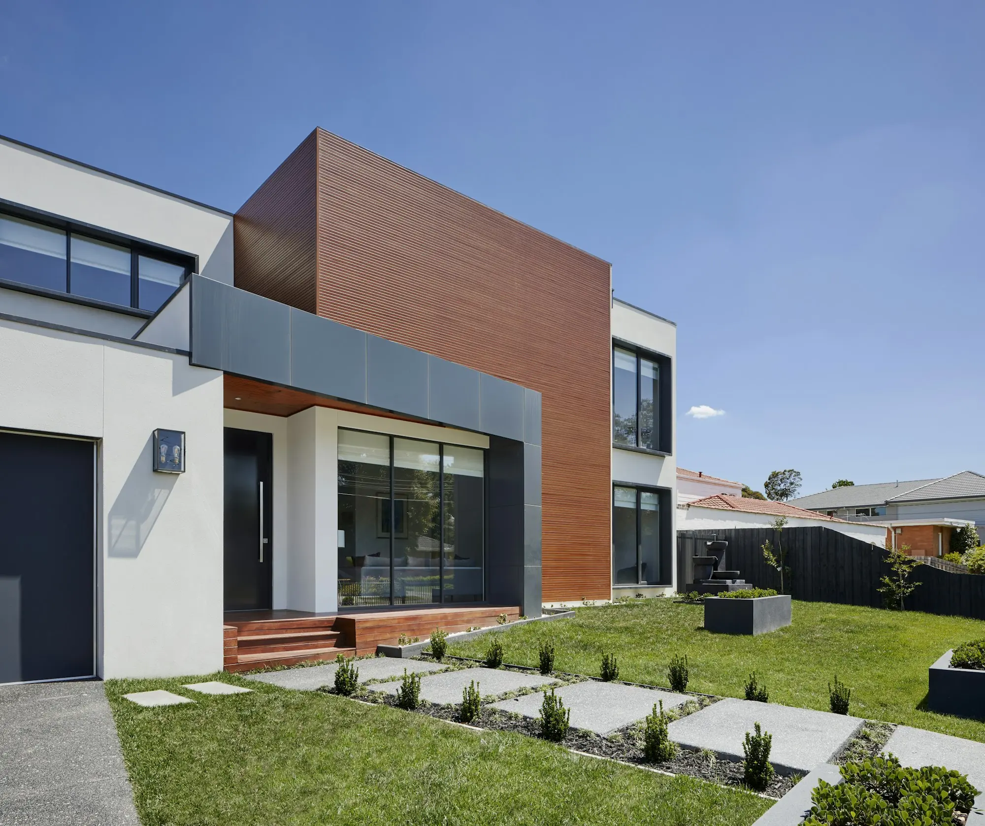 Luxury home exterior with clean modern lines at dusk